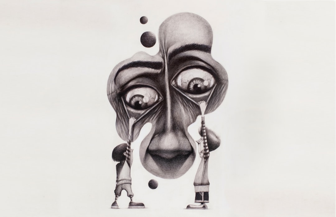 a pencil drawing of a face with eyes and a nose — Foto por Pedro Miguel Aires na Unsplash
